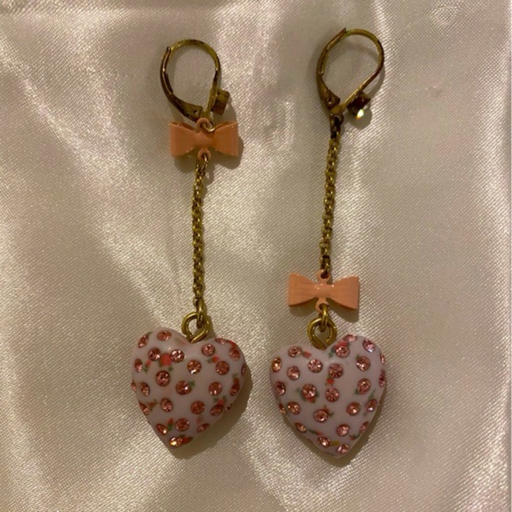Two Pairs of Earrings by Betsy Johnson.